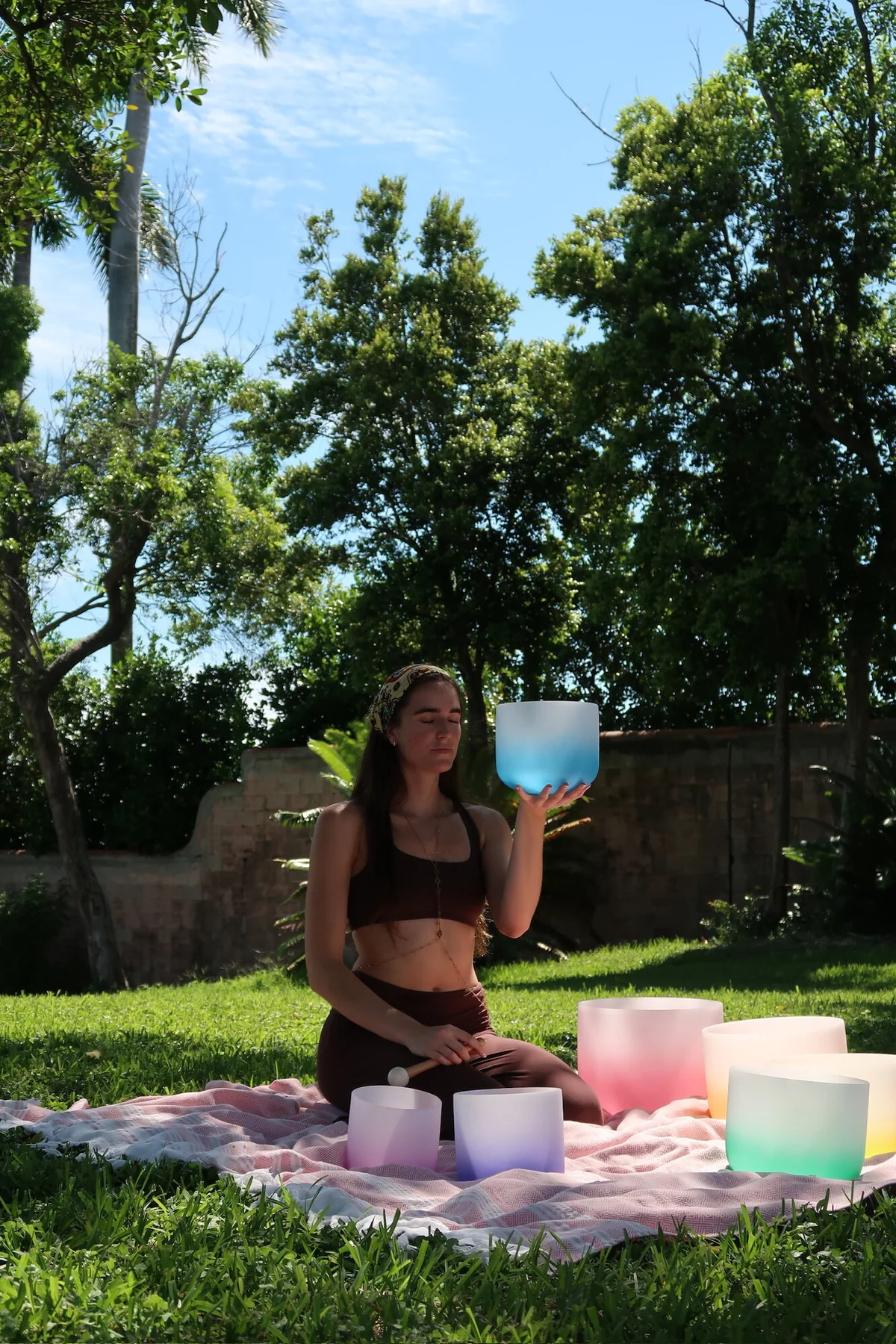 Tatiana Gentile holding a blue singing bowl outdoors